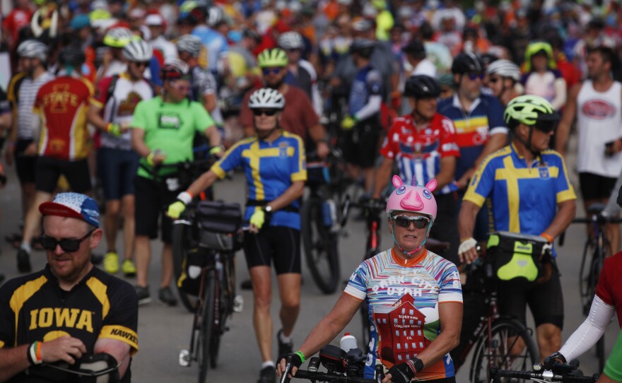 Thousands of riders flood the streets of downtown Schaller, Iowa, a town with a population of just over 700 people, on Monday, July 25, during Day 2 of RAGBRAI.