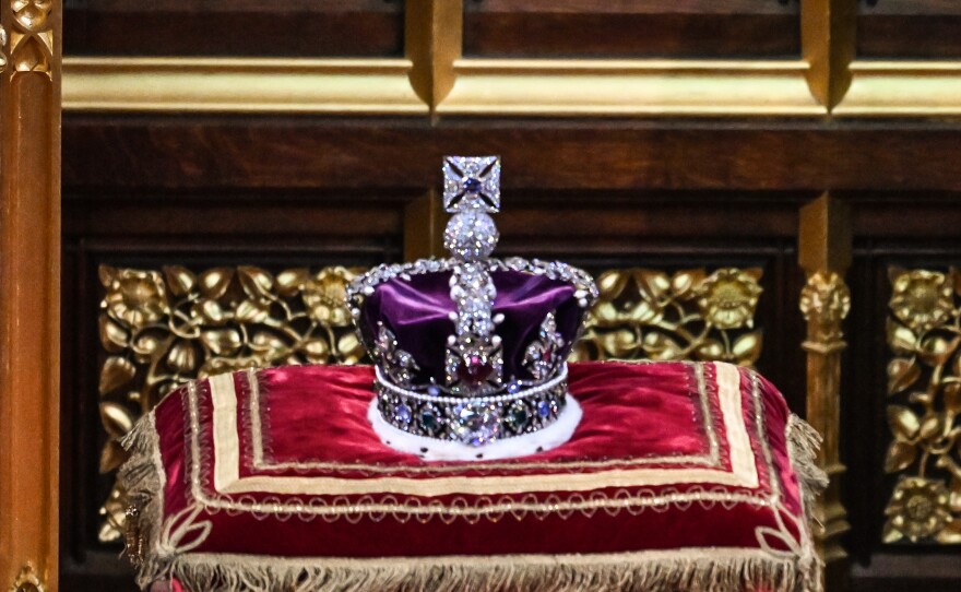 The Imperial State Crown sits on display during the State Opening of Parliament in the House of Lords in London on May 10, 2022.