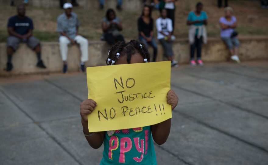 Many of the protests on Wednesday, like the demonstration attended by this little girl, were peaceful. Charlotte has a reputation as a tolerant, diverse and progressive city, but a police killing last year had shaken that perception even before the events of Tuesday and Wednesday.