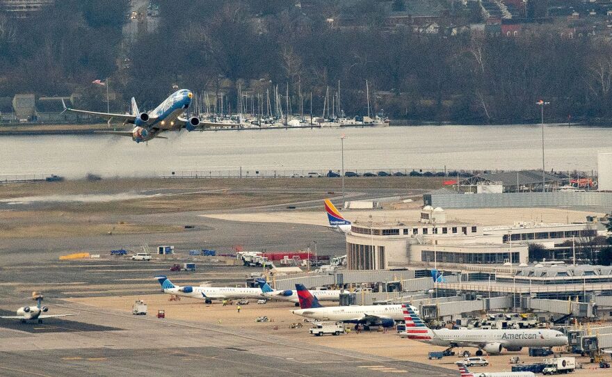 An Alaska Airlines plane takes off from Ronald Reagan National Airport in Arlington, Virginia, on Jan. 18, 2022.
