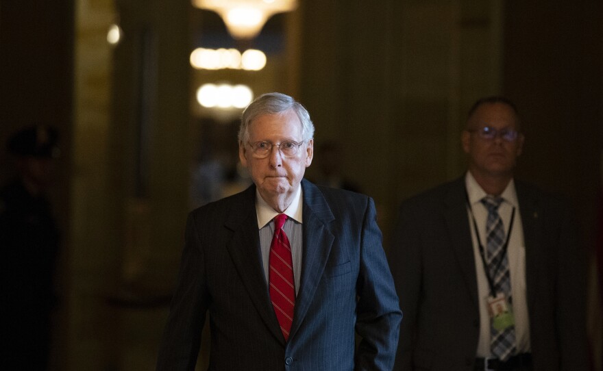 Senate Majority Leader Mitch McConnell of Kentucky walks to the Senate floor for a vote on Thursday.