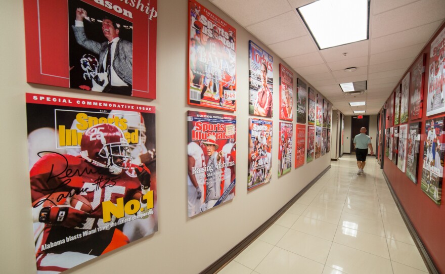 Throughout the Alabama Football administrative building, there are reminders of the Crimson Tide's dominance. Magazine covers highlight the team's success.