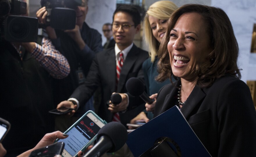 Sen. Kamala Harris speaks to reporters following a closed briefing on intelligence matters on Capitol Hill on Dec. 4, 2018.