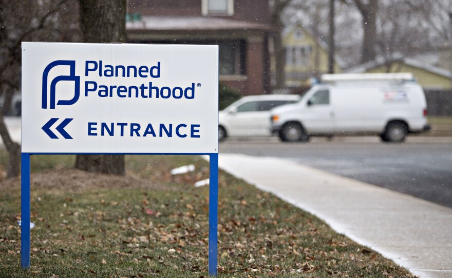 Signage is displayed outside a Planned Parenthood office in Peoria, Illinois, U.S., on Friday, Dec. 16, 2016.