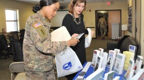  New York Assistant Attorney General Deanna Nelson (right) assists a soldier after leading a presentation about identity theft at Fort Drum, New York in 2017.