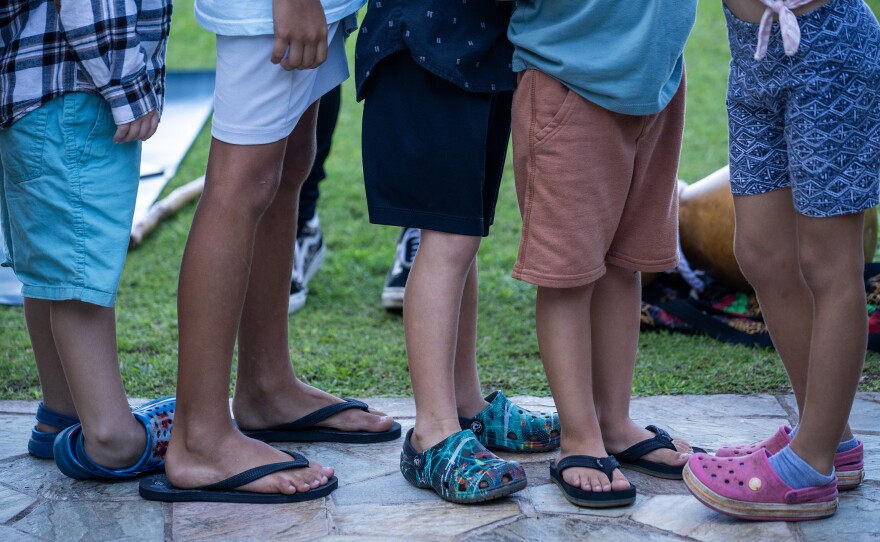 Kids line up after yoga class. Maui Arts and Cultural Center (MACC) Arts and Healing programming is held at the Royal Lahaina Resort where many displaced residents are temporarily staying.