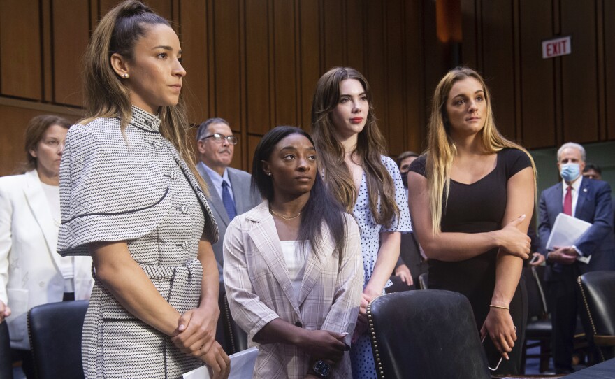 Gymnasts from left, Aly Raisman, Simone Biles, McKayla Maroney and Maggie Nichols, leave after testifying at a Senate Judiciary hearing about the Inspector General's report on the FBI's handling of the Larry Nassar investigation on Sept. 15. Nassar was charged in 2016 with federal child pornography offenses and sexual abuse charges in Michigan and is now serving decades in prison.