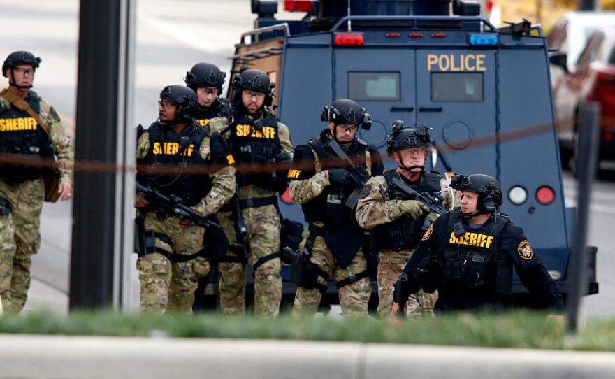 Law enforcement officials outside of a parking garage on the campus of Ohio State University as they respond to an active attack on Monday in Columbus, Ohio.