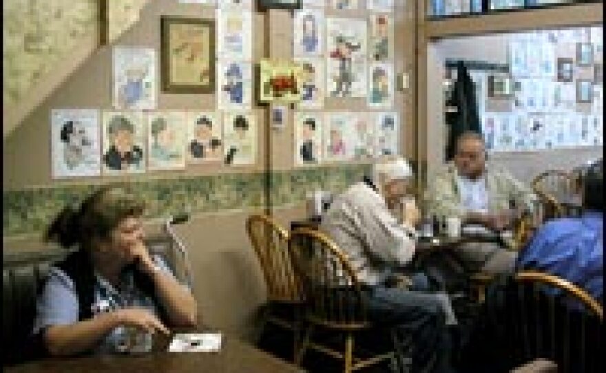 The early-morning coffee crowd at Hammond's Family Restaurant in Madison, Ind., talks politics beneath caricature drawings of steady customers.