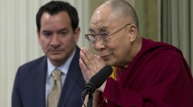 The Dalai Lama, right, bows before speaking at a joint session of the California Legislature, June 20, 2016. Assembly Speaker Anthony Rendon, D-Paramount, left, looks on.
