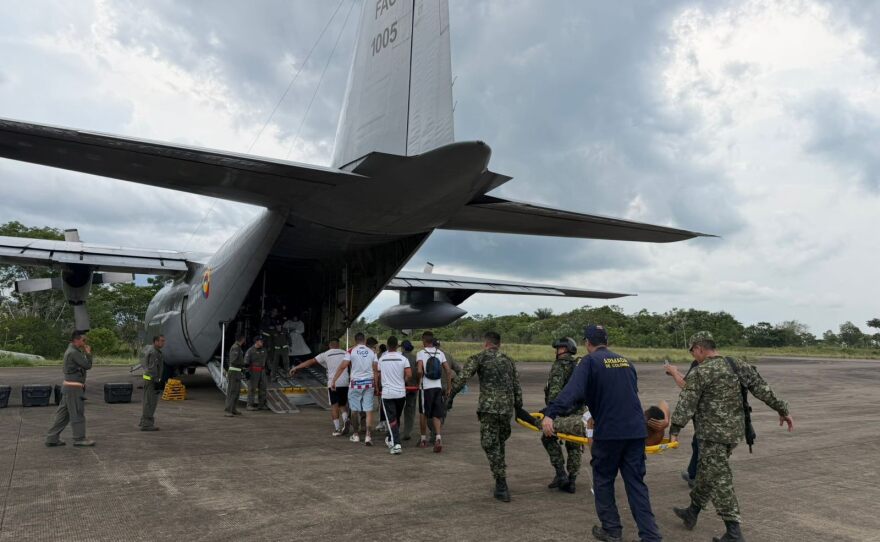 In this photo distributed by Colombia's Armed Forces press office, people who were injured on a military cargo plane that crashed shortly after take off are loaded on to another military plane to evacuate them for treatment, from Puerto Leguizamo, Colombia, Monday, March 23, 2026.