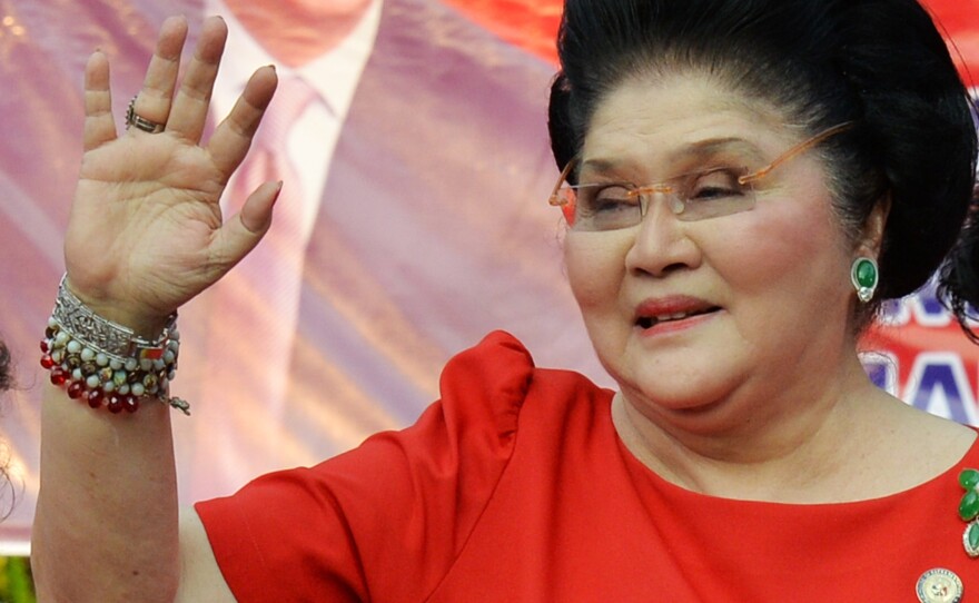 Former first lady Imelda Marcos — whose abandoned collection of thousands of shoes became notorious as a symbol of excess after her husband was deposed as leader in 1986 — waves to supporters after her son Ferdinand Marcos, Jr., announced his vice presidential bid. Imelda Marcos, meanwhile, is an incumbent running to keep her a seat in Congress.