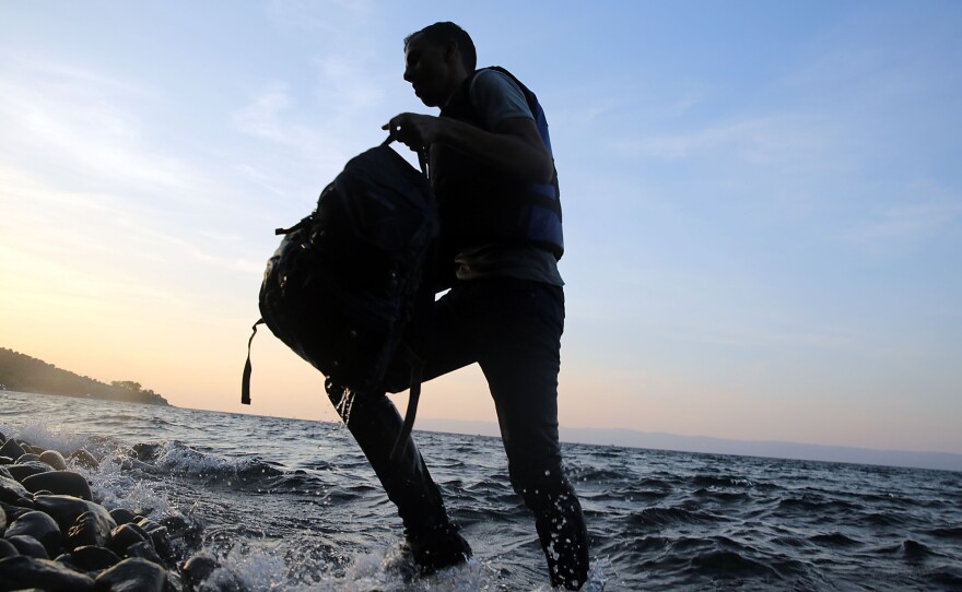 A Syrian migrant was on a raft from Turkey to the Greek island of Lesbos.