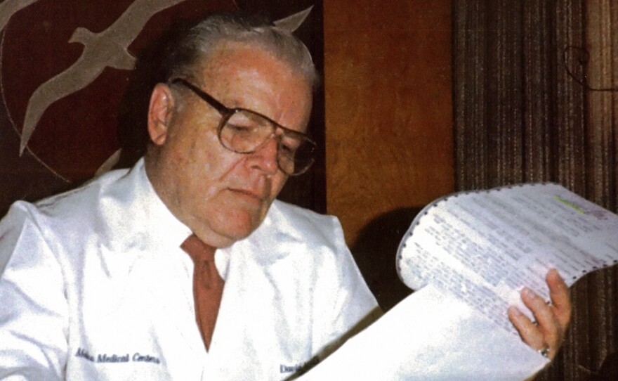 Dr. C. David Molina reviewing medical records in the 1980s. He was a doctor first, then a health insurer.