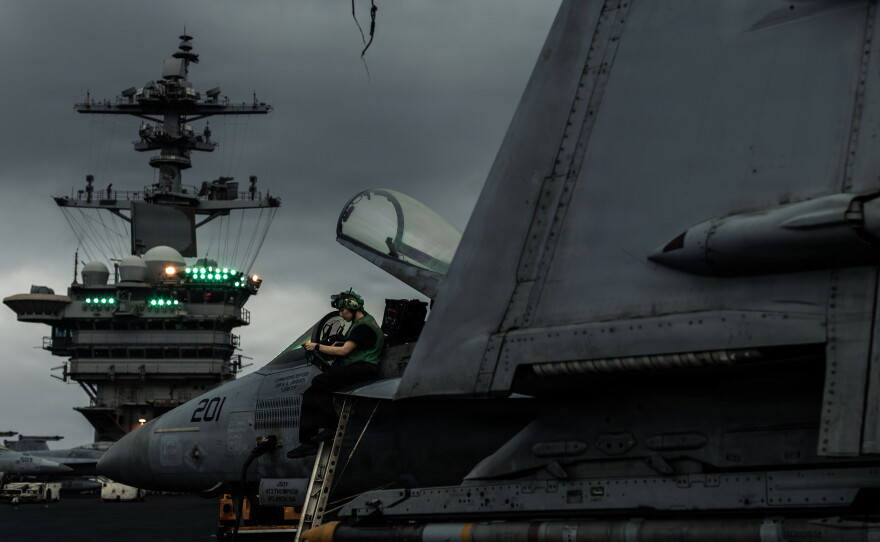 A U.S. Sailor conducts an inspection on an F/A-18E Super Hornet, attached to Strike Fighter Squadron (VFA) 14, on the flight deck of Nimitz-class aircraft carrier USS Abraham Lincoln, June 27, 2026.