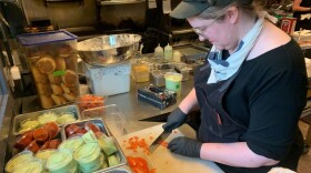 Chef Lindsay Kucera prepares for dinner service at Jack Sprat, a small restaurant in the Alaska ski resort town of Girdwood. About one-third of the staff left during the pandemic.
