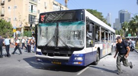 Emergency services rush to the scene of an explosion on a bus on November 21, 2012 in central Tel Aviv, Israel. 