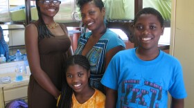 Monique Blackmon and her three children, Deja (aged 16), Trinity (11) and Zion (12) in their room at the intake center for "Solutions for Change." 