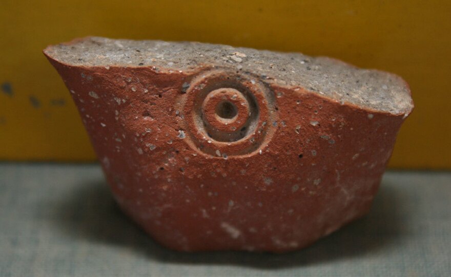 A jar handle stamped with concentric circles, excavated from a site in Jerusalem called Ramat Rahel.
