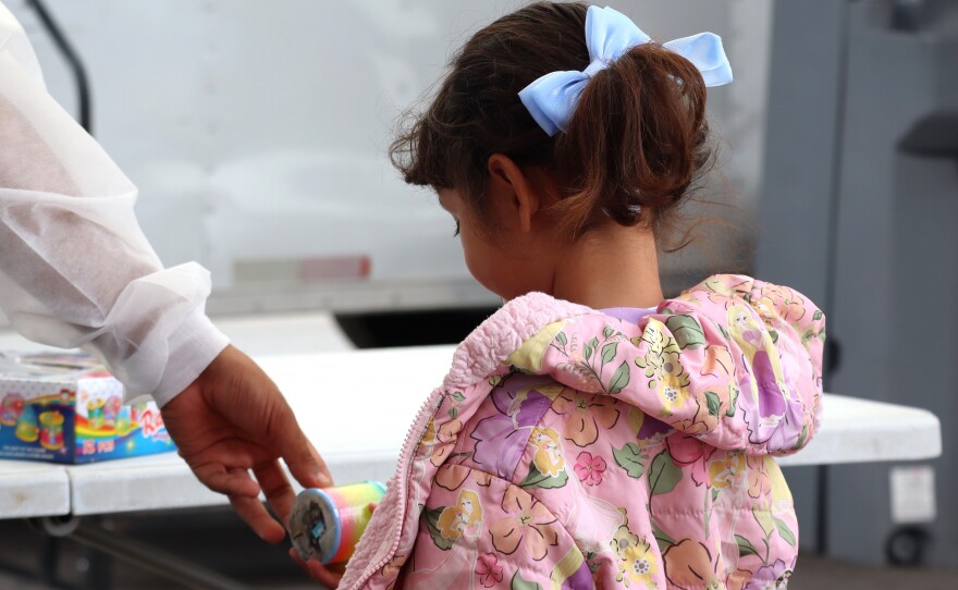 A child selects a toy after a visit to the University of Southern California's mobile dental clinic on Tuesday, July 22, 2025.