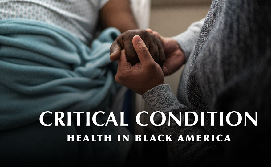 Son holding father’s hand at the hospital. "Critical Condition: Health in Black America"