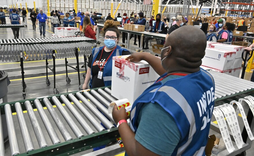 The first box of the Johnson & Johnson COVID vaccine departs from the McKesson facility in Shepherdsville, Kentucky on Monday. The company is set to distribute its first 3.9 million doses across the country this week.