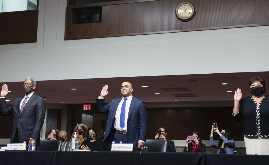 From left: Julien Xavier Neals, nominee to be U.S. district judge for the District of New Jersey; Zahid Quraishi, nominee to be judge for the District of New Jersey; and Regina Rodriguez, nominee to be judge for the District of Colorado are sworn in during an April 28 Senate Judiciary Committee hearing. Quraishi has become the first Muslim American federal judge.