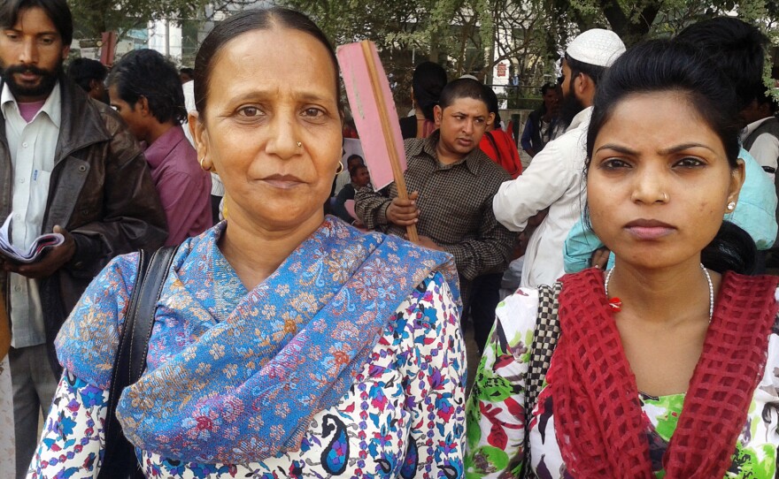 Sudha, a 42-year-old widow (left) sells purses at a market in West Delhi. Lately, she says her business has suffered as more people opt to shop in malls.