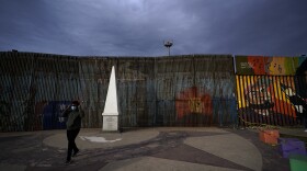 A man passes at Friendship Park, near where the border separating Tijuana, Mexico, and San Diego meets the Pacific Ocean, Jan. 19, 2021, in Tijuana, Mexico.