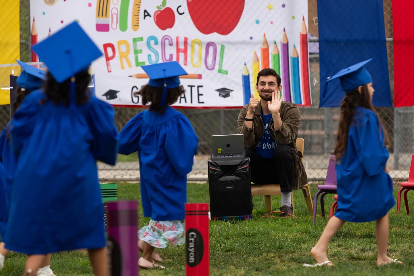 Students participate in a graduation ceremony at Mi Escuelita in San Diego on June 11, 2025.