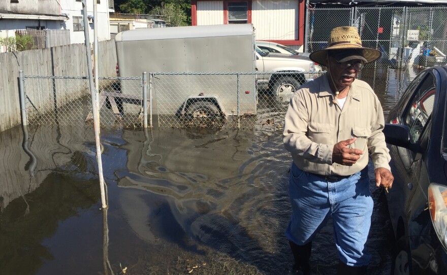 In Lafayette, George Alexander checks on an elderly neighbor's property for the first time since the evacuation. A resident here since 1959, Alexander isn't sure when – or if – he'll be able to move back to his own home due to the extensive damage.