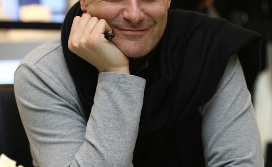 Mizrahi has become a familiar face in fashion, appearing on QVC and <em>Project Runway All Stars.</em> He's pictured above at the Liz Claiborne New York Spring fashion show in March 2009.