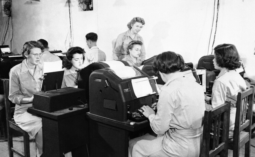 Teletype operators relaying U.S. military communications in North Africa during World War II.