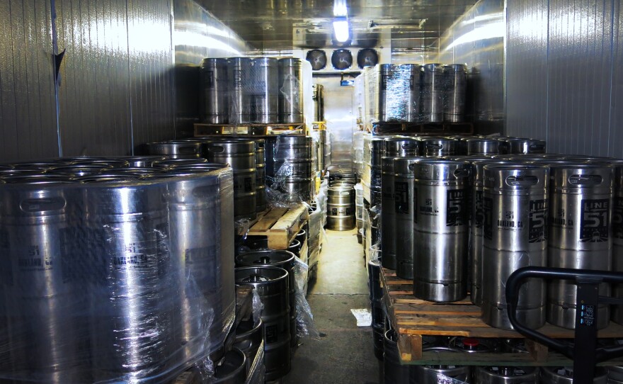 When the home-brewing gets good, the teachers turn pro. Kegs of Line 51 beer line the company's Oakland warehouse.