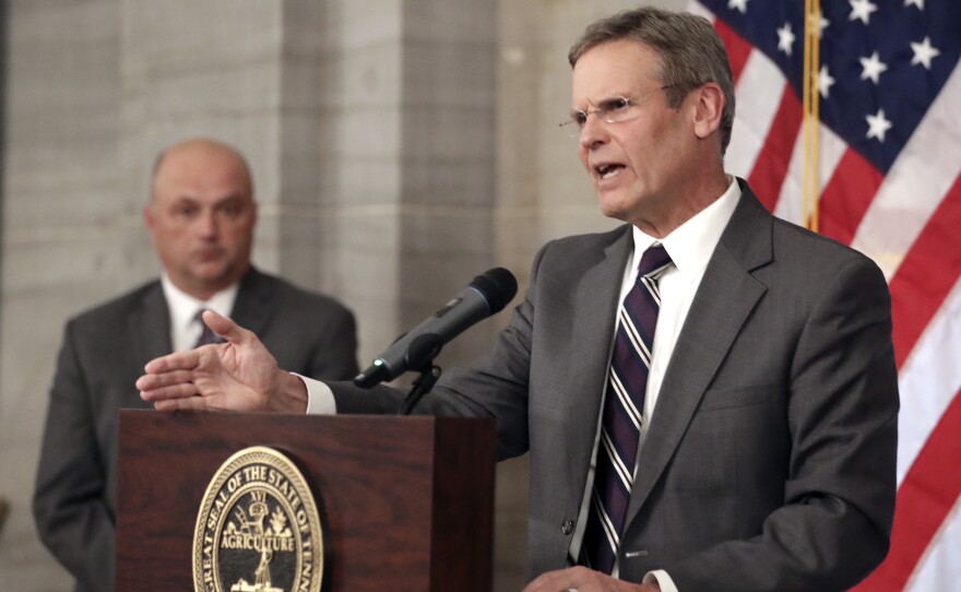 Tennessee Gov. Bill Lee, right, answers questions concerning the state's response to the coronavirus Monday, March 16, 2020, in Nashville, Tenn.