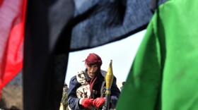 A Libyan rebel prepares to battle against government forces on March 24, a few miles from the key city of Ajdabiya as U.N. Secretary-General called today on both sides to cease fire, as the Security Council prepares to hold a new meeting on the crisis.