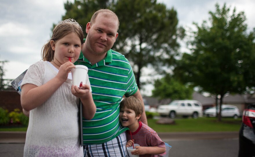 David Huffman leaves Eastlake Elementary with his children Moira, 8, and Wendy, 5. Moira attends Eastlake and Wendy will start kindergarten there next year.