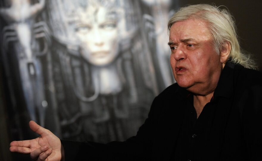 Swiss artist H.R. Giger, seen here at his Dreams and Visions exhibition in 2011, died Monday after a fall in Zurich. Giger's work includes designs for the 1979 film Alien.