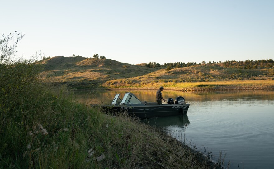Schaaf starts his boat to head home after scouting for elk.