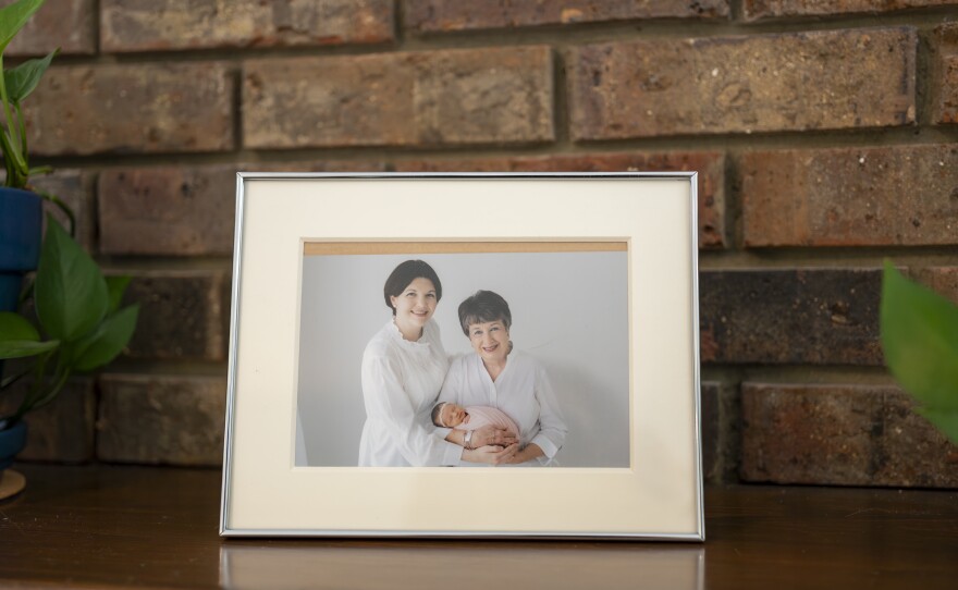 A framed photo of Laura Terry with her mother, Jo, holding baby Eleanor.