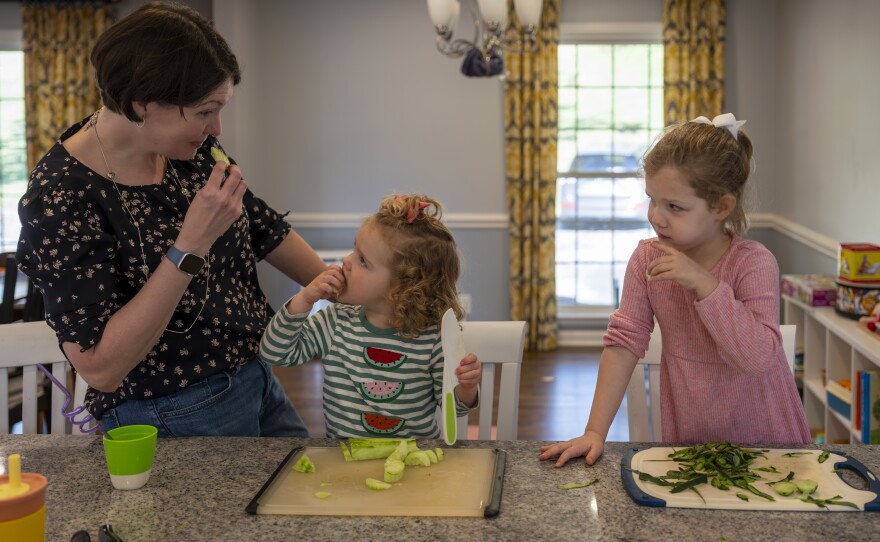 Terry actively tries to find ways to engage her kids. Sometimes she buys a "decoy cucumber" so that when she's prepping dinner, 4-year-old Eleanor can peel it and feel helpful. Terry says, "It's a great use of 75 cents for an extra cucumber."