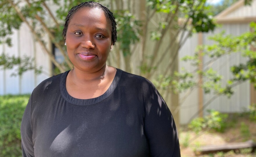 Tiffany Hathorn poses for a picture on June 29. She earned her trucking license a year ago and estimates she will make $70,000 this year. Hathorn says she recommends anybody who asks – men or women – to become a truck driver.