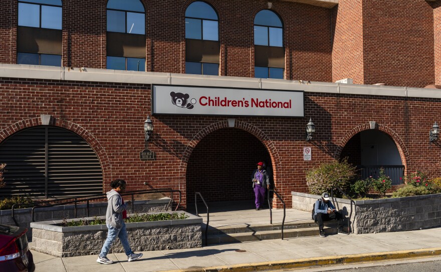 People walk past Children's National's Anacostia clinic in Washington, D.C. on November 16, 2023. In a growing number of institutions around the country, lawyers are teaming up with doctors in an effort to help patients overall health.