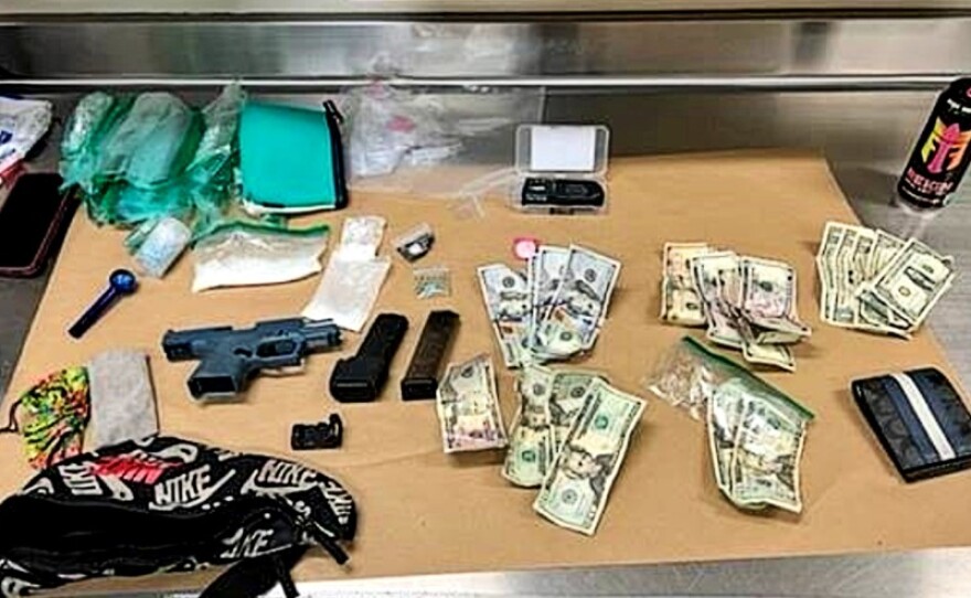 Illegal drugs, cash, and a "ghost gun" seized from Craig Blas after police arrested him on May 7, 2022.