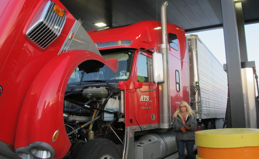 Drivers fill up at the Petro truck stop in Oak Grove, Mo. When most drivers are paid by the mile, delays at stops eat directly into their earnings — another reason why people aren't flocking to the industry.