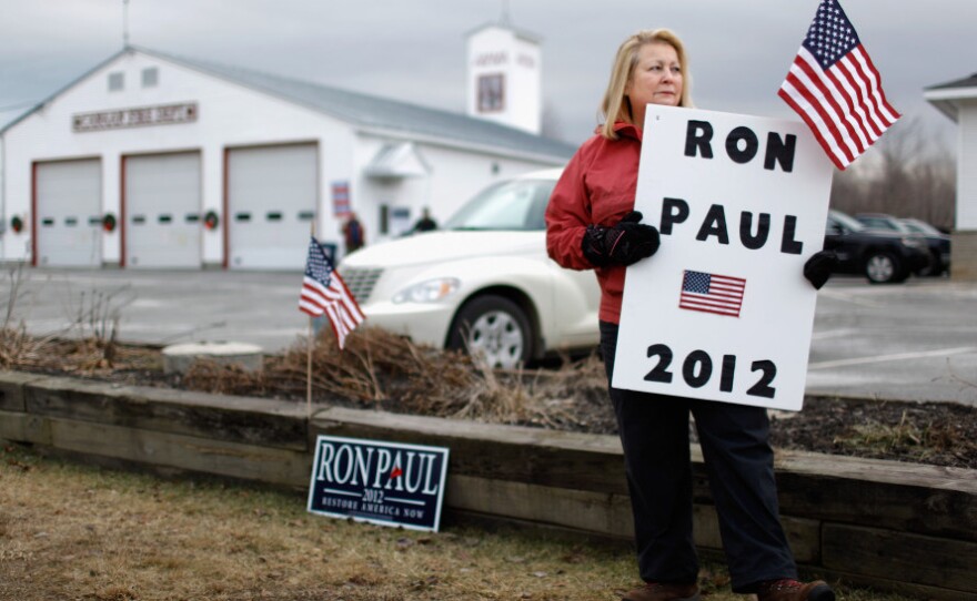 Susan Gayhart stations herself outside the polls at a fire station in Canaan, N.H., on the morning of the primary.