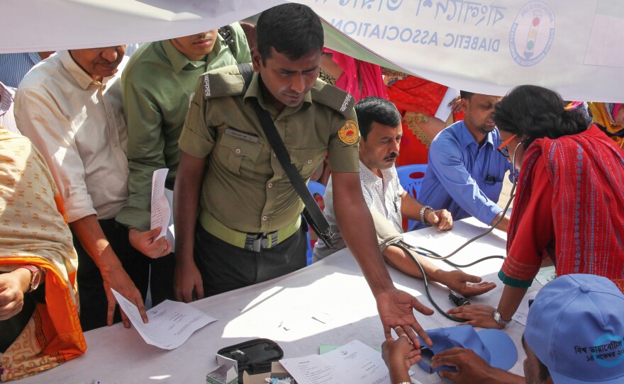 A man gets tested for diabetes at an event in Dhaka, Bangladesh, for World Diabetes Day in 2019.