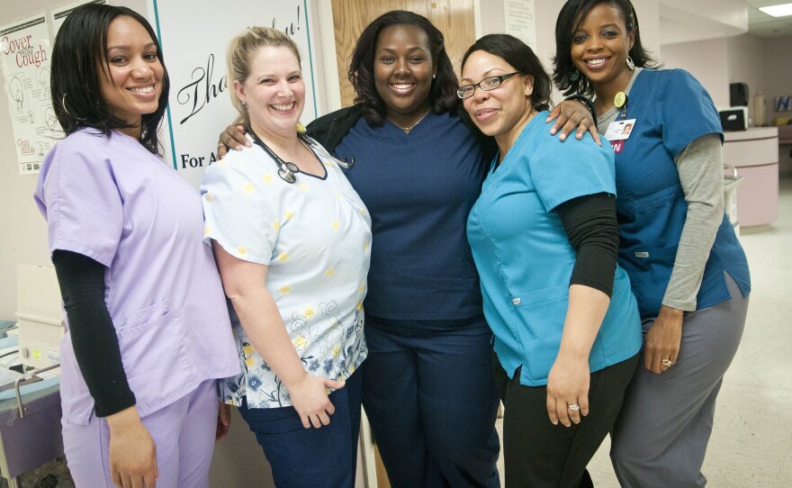Teammates (from left) Erica Webster, Peggy Renzi, Erica Heressy, Quan Harper and Nyuma Harrison entered a national weight loss contest in hopes of winning $10,000.