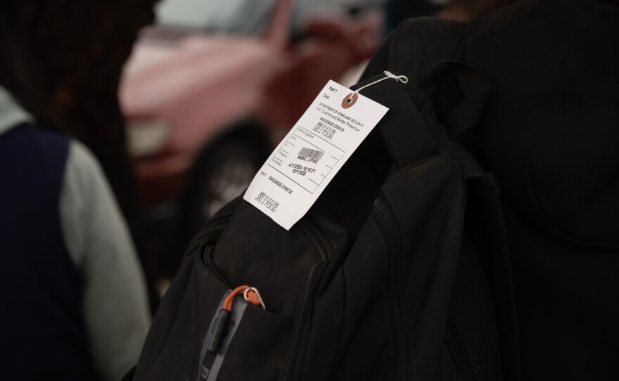 A "baggage check" tag attached to a migrant's backpack is shown on April 19, 2024. These tags are a sign that migrants have been detained and processed by CBP.