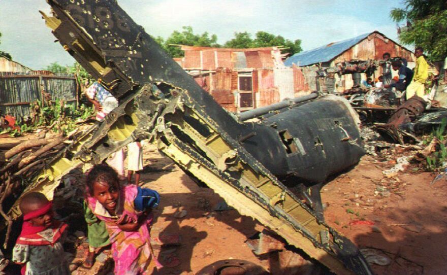 In December 1993, Somali children play around the wreckage of a U.S. helicopter in Mogadishu.